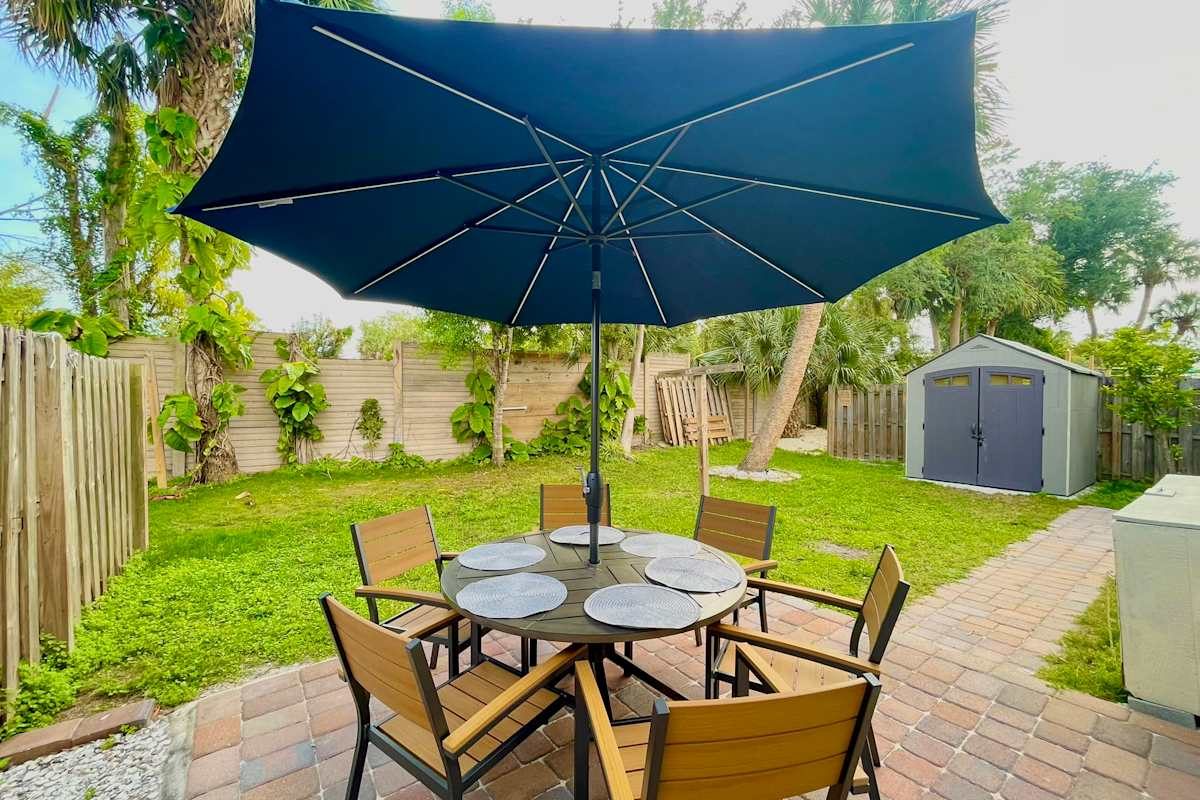 Back patio and yard at Near Ft Myers Beach - 3mi to Sand - Sleeps 7, Fort Myers Beach FL